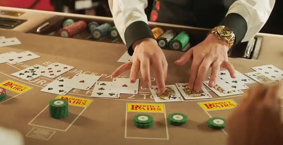 blackjack dealer dealing cards at the table.